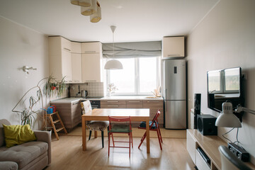 A spacious kitchen-living room in the apartment. No one, no people.