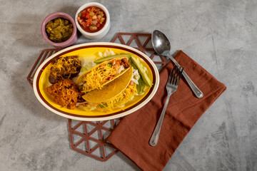 Taco plate with spanish rice and beans