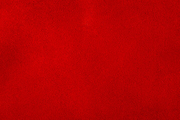 Red suede leather macro photo as background material for designers.