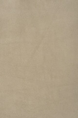 Beige suede background as a material for designers. Suede texture.