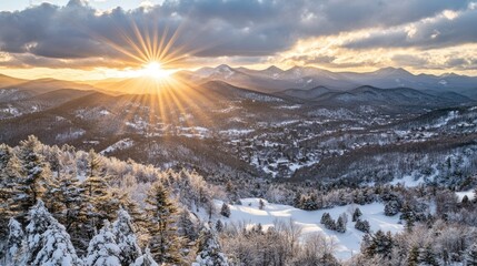 The sun's rays spill over snowy mountain peaks, creating a dazzling and serene winter scene.