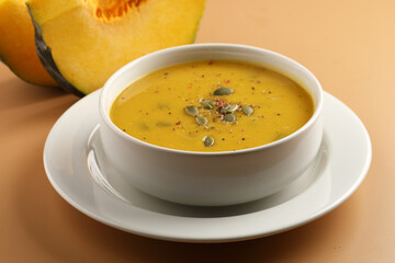 Pumpkin soup. Vegetarian soup with pumpkin seeds in ceramic bowl