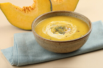 Pumpkin soup. Vegetarian soup with pumpkin seeds in ceramic bowl