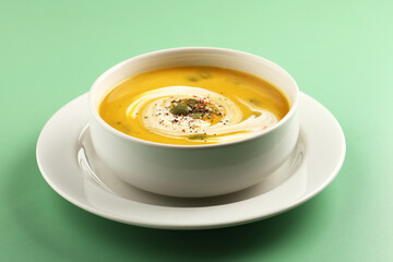 Pumpkin soup. Vegetarian soup with pumpkin seeds in ceramic bowl