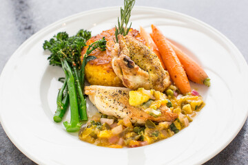 A plate of food with a variety of vegetables and meat
