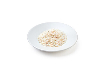 Psyllium husk powder on white plate isolated on white background. Psyllium husk has increasing the volume of feces and amount of water in the intestines, It's used as a laxative to treat constipation.
