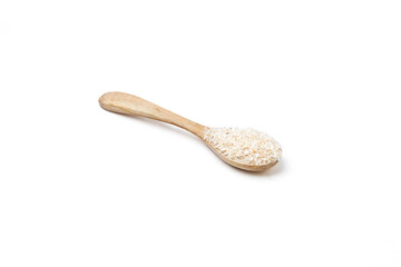 Psyllium husk powder on wooden spoon isolated on white background. Psyllium husk has increasing the volume of feces and amount of water in the intestines, It's used as a laxative to treat constipation