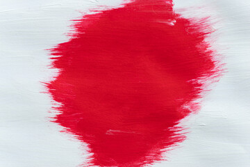 赤色と白いの絵具で塗った背景