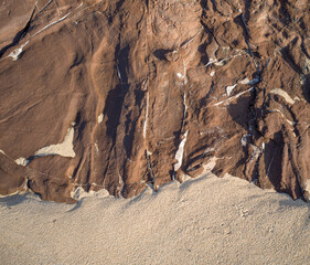 Brown Rock Cliff on a Sandy Beach in Honolulu, Hawaii