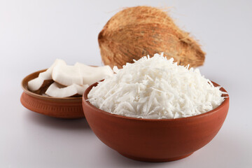 Desiccated coconut in terracotta bowl 