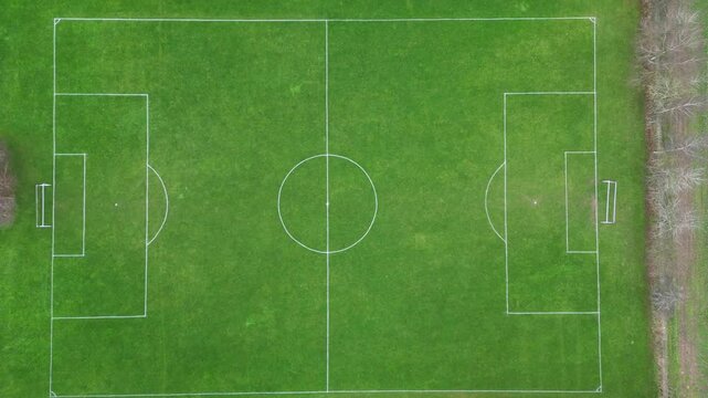 A 4K bird's eye view of a soccer field, showcasing the full layout of the pitch and the action. Ideal for sports, cinematic, and aerial content.

