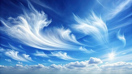 Soft white clouds float gently in a blue sky with a few wispy strands stretching out across the horizon, nature