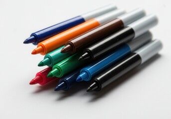 Colorful set of assorted markers on white background