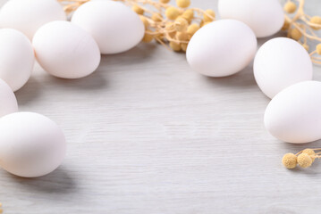 White eggs on white background with copy space