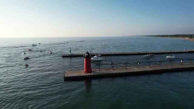 Aerial view of the light house of south haven beach with boats in lake michigan
