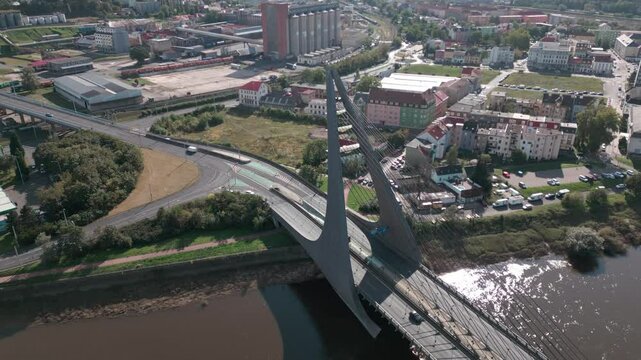 Aerial view of Mari&aacute;nsk&yacute; most, a cable-stayed bridge in Usti nad Labem, spanning over a river with surrounding urban and industrial areas