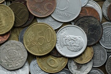 Naklejka premium Big pile of different coins from various currencies and different countries around the world. Currency exchange