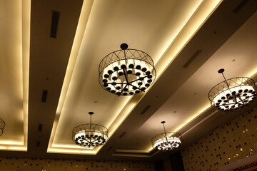 artistic chandeliers on the hotel ceiling.