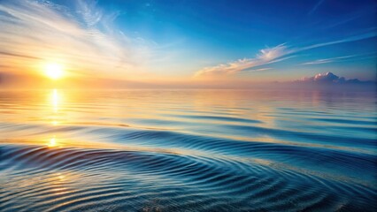 Fototapeta premium Gentle morning mist over calm ocean waves with sea ripple effects creating a serene and peaceful atmosphere, calm waters, sea ripples