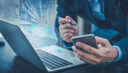 Manager man using smart phone and computer process Analyzes, check and control product in stock warehouse, modern software, management system in Factory. Futuristic technology concept