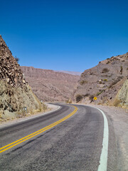 Asphalted highway through the desert mountains in northern Argentina