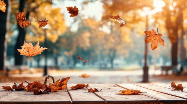 A serene autumn scene with colorful leaves falling, showcasing a wooden table and a picturesque park background illuminated by warm sunlight. - Powered by Adobe