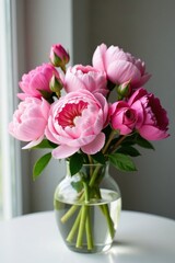 Fototapeta premium Freshly picked pink peonies and roses in a vase, pink peonies, flower arrangement