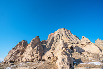 The scenic views of Selime Castle which is the largest and most elaborate cave complex in Cappadocia. The multi-level Byzantine settlement includes a kitchen, halls, church, and rooms in Güzelyurt