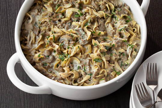 Family-Style Mushroom and Beef Stroganoff Noodle Dinner with creamy sour cream sauce and minced parsley