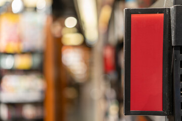 Vivid Red Signage Against a Blurred Background in Urban Setting