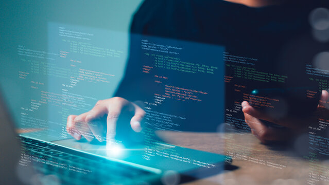 Computer programmer, software engineer typing, coding javascript on laptop computer, software development concept. Website design and coding technology
