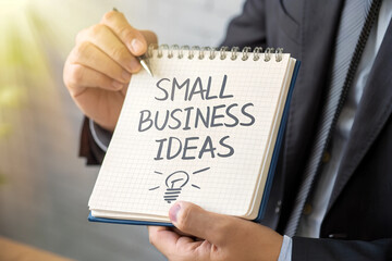 businessman holding notepad with inscription - Small Business Ideas - close-up
