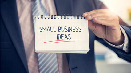 businessman holding notepad with inscription - Small Business Ideas - close-up
