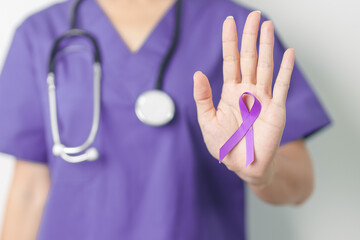 Doctor holding purple Ribbon for Violence, Pancreatic, Esophageal, Testicular cancer, Alzheimer,...