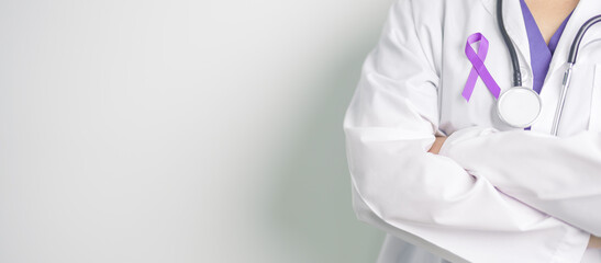 Doctor holding purple Ribbon for Violence, Pancreatic, Esophageal, Testicular cancer, Alzheimer, epilepsy, lupus, Sarcoidosis and Fibromyalgia. Awareness month and World cancer day concept