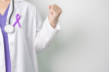 Doctor holding purple Ribbon for Violence, Pancreatic, Esophageal, Testicular cancer, Alzheimer, epilepsy, lupus, Sarcoidosis and Fibromyalgia. Awareness month and World cancer day concept