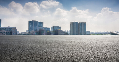 Modern Urban Landscape with Reflective Surface Under Dramatic Sky