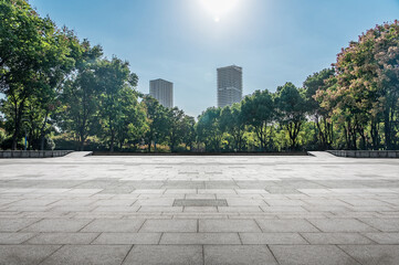 Serene Urban Park Setting Surrounded by Lush Greenery and Modern Architecture
