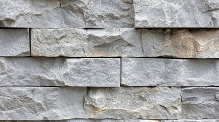 Close-up of a light gray stone wall with rough textures and subtle grunge details, offering a modern and abstract background for banners
