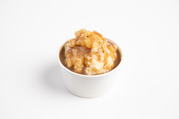 mashed potato in a white cup isolated on white background