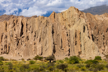 Fototapeta premium Scenery looking across the dry Rio Calchaquí on the road to Santa Rosa de Tastil, Salta Province, Argentina.