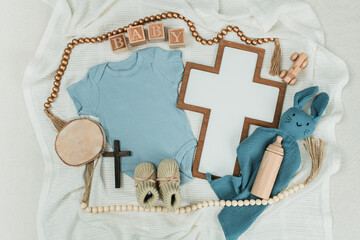 Blue Boy Baptism Flatlay with Cross, Baby Romper, Pearl Rosary, and Elegant Ceremony Accessories...