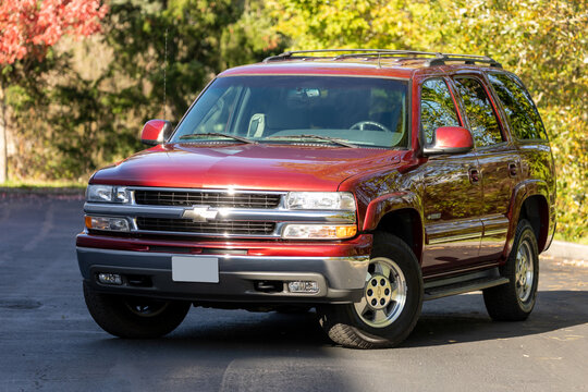 Portland, OR, USA - Oct 22, 2020 - 2001 Burgundy Chevrolet Tahoe Chevy classic pickup truck American 4X4 off-road vehicle exterior design, rugged performance, vintage styling