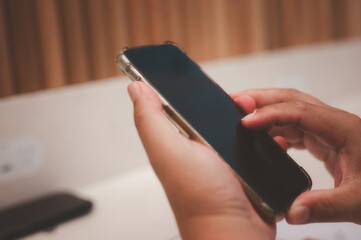 Social media marketing concept. man hand using smartphone typing, chatting conversation in chat box icons pop up typing on a phone for communication search networking and texting on a mobile app