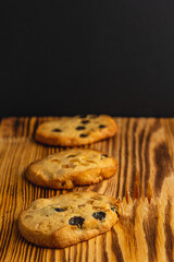 Festive homemade cookies with raisins on a wooden table Christmas concert