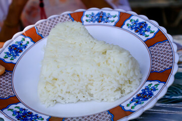 Heart shaped steamed rice on a plate to welcome Valentine Day