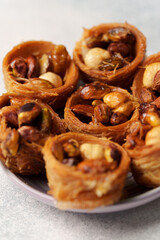 Delightful assortment of traditional pastry filled with nuts served on a plate