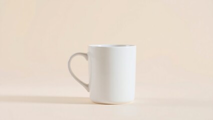 A single white mug sits on a beige background