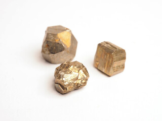 Small pyrite healing stones on a white background