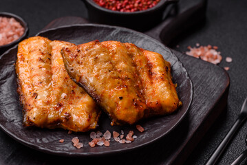 Grilled fish fillet with salt, spices and herbs